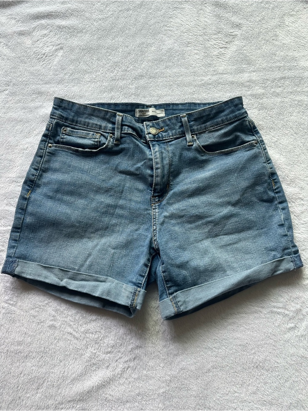 Light denim mid rise shorts